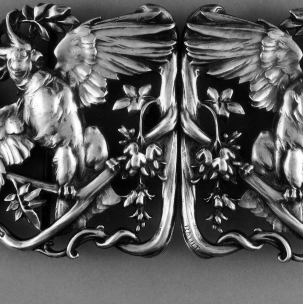Cast and chased silver waist-clasp (in two pieces) in the form of two parrots on branches by Louis Armand Rault