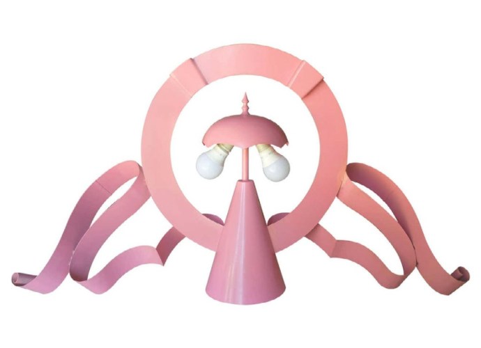 Pink sculptural lamp by Lapo Binazzi featuring whimsical curves and a bold geometric design.