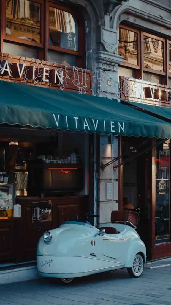 three wheel car parked in downtown