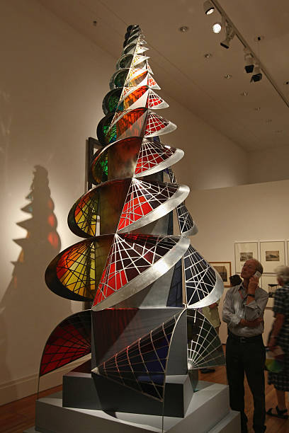 A visitor looks at the sculpture "Tower of Fire" by Johannes Itten at the "modell bauhaus" exhibition on the first day of its opening to the public