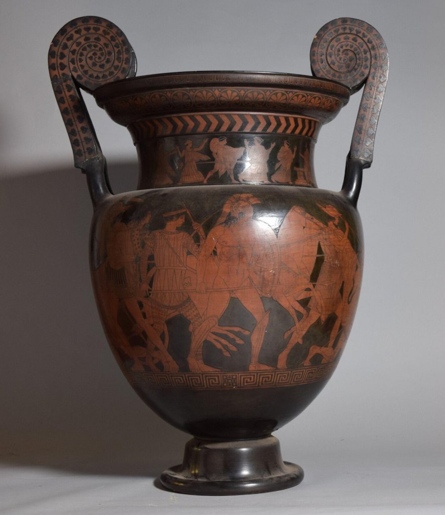 A 19th-century Colonnese pottery vase, inspired by ancient Apulian red-figure ceramics, featuring classical Greek motifs and intricate black and red decorative patterns.