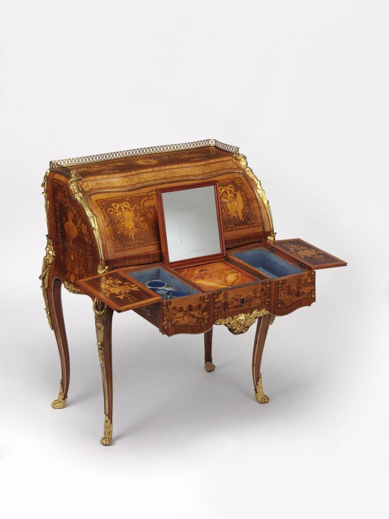 A lady's writing desk and dressing table (secrétaire-toilette), decorated in marquetry of tulipwood, harewood, boxwood and other woods,