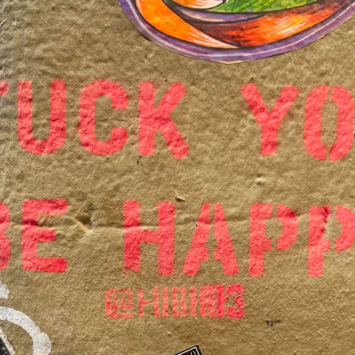 F**k you Be Happy: A Stencil’s Bold Message