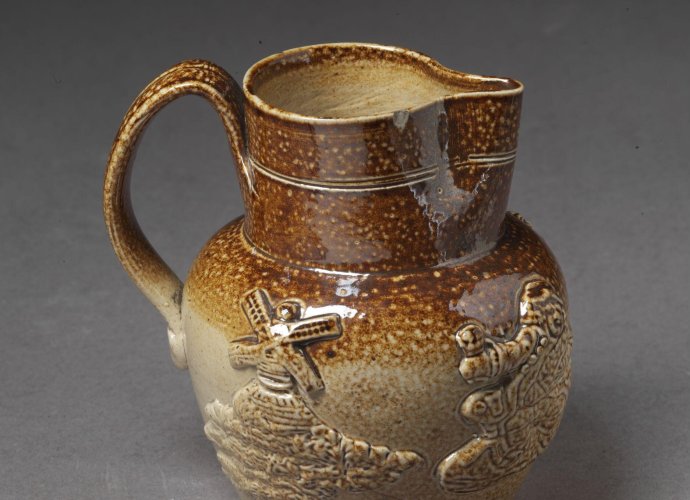 Jug of salt-glazed stoneware with applied decoration in relief, possibly made in Belper or Denby, ca. 1830.