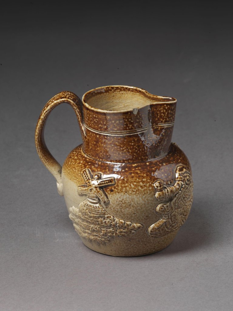 Jug of salt-glazed stoneware with applied decoration in relief, possibly made in Belper or Denby, ca. 1830.