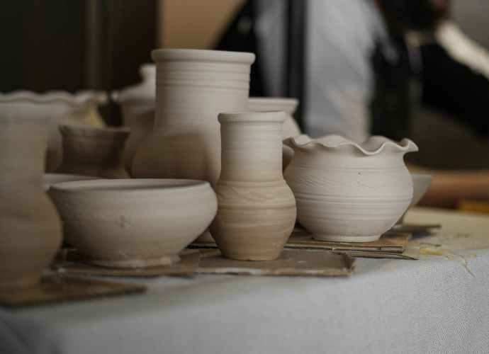 raw clay vases and bowls