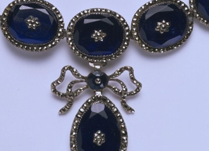Necklace of blue foiled paste gems with a pyrite (commonly known as marcasite) border, set in silvered copper and hung with a pendant, possibly France, about 1810-40