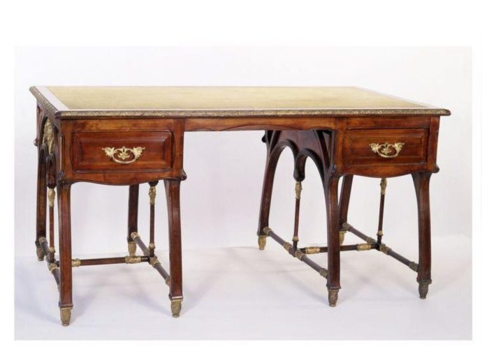 Writing table of carved and turned pearwood with mounts of gilt brass designed by Louis Bigaux