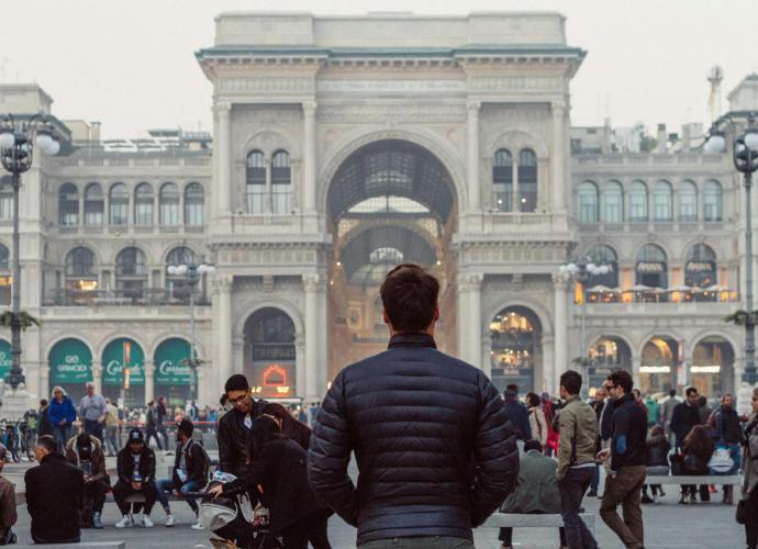 man standing in downtown milan