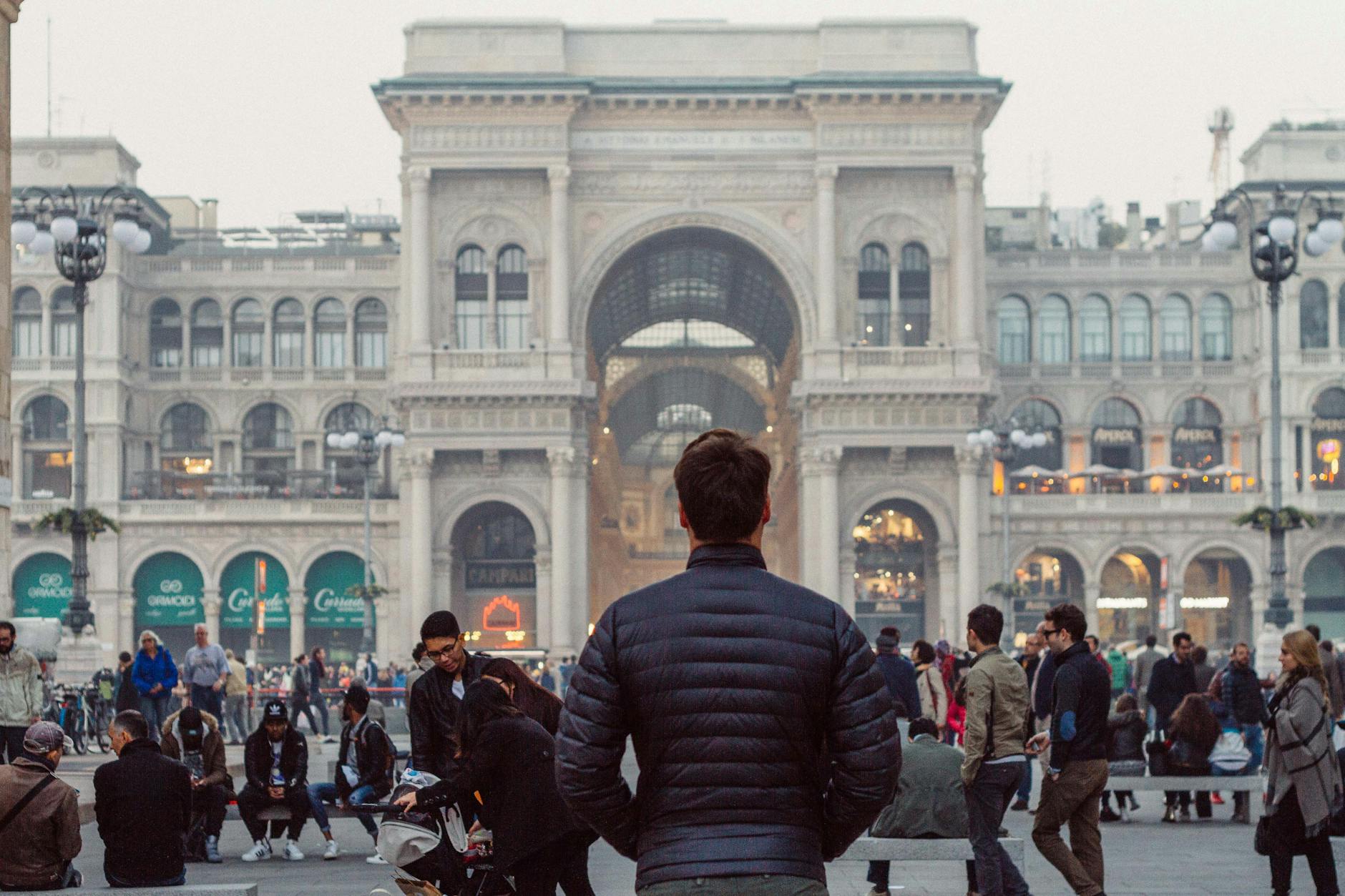 man standing in downtown milan