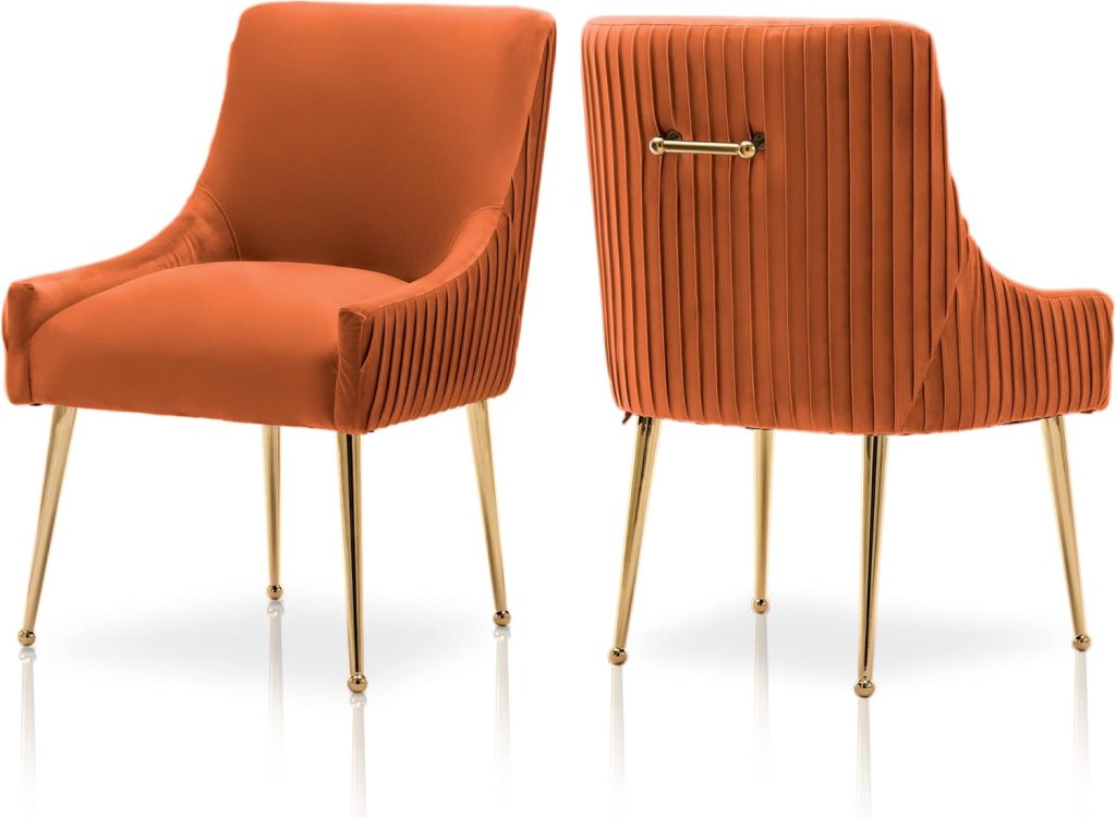 Modern orange upholstered dining chair with gold legs, featuring pleated velvet back detailing and ergonomic design for dining or living room spaces.