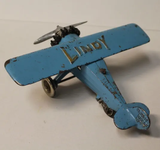 Blue cast iron Lindy toy airplane with silver propeller, manufactured by Hubley in the 1920s
